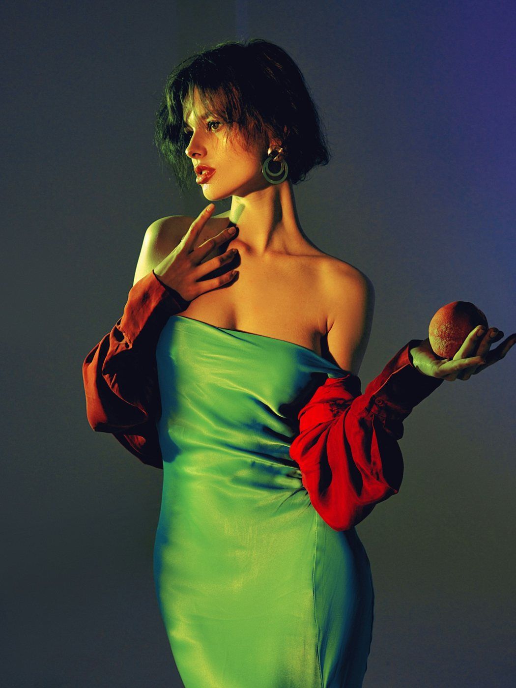 Model in a green satin dress