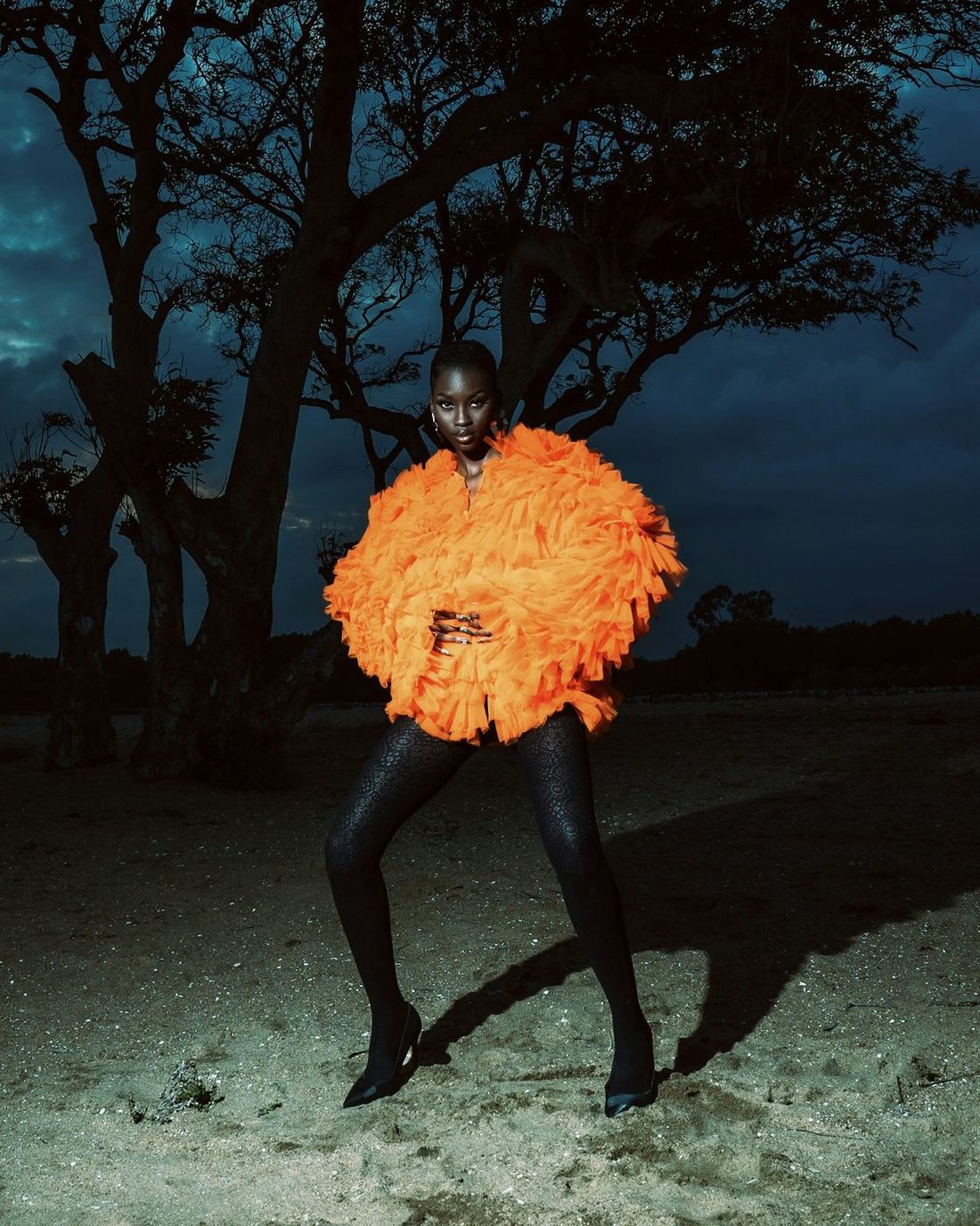Detail of an orange ruffled jacket